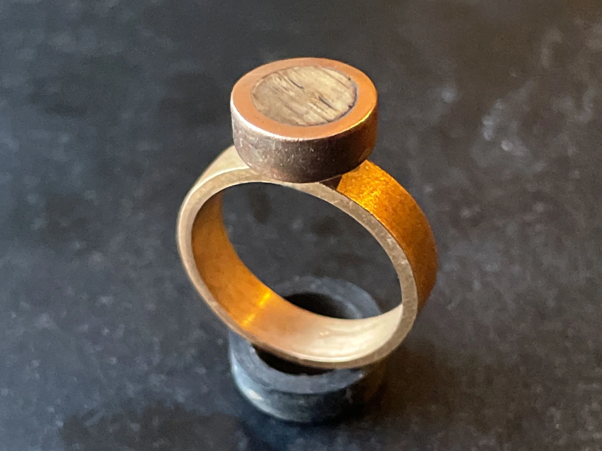 Hand-made ring in bronze and timber