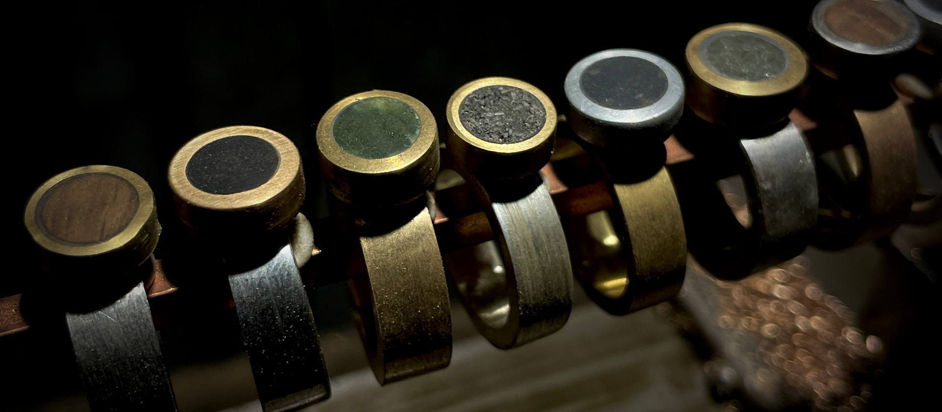 Collection of mixed-metal rings with varied inset materials